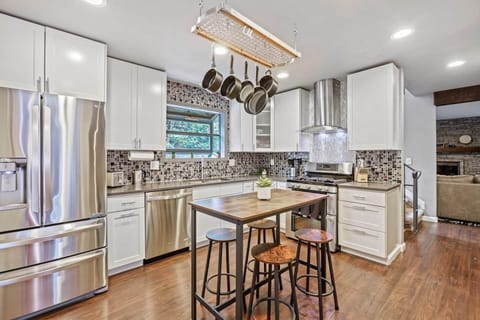 Elevate your dining experiences in our expansive kitchen with upgraded appliances, modern interiors and stocked with essentials for a convenient cooking experience.