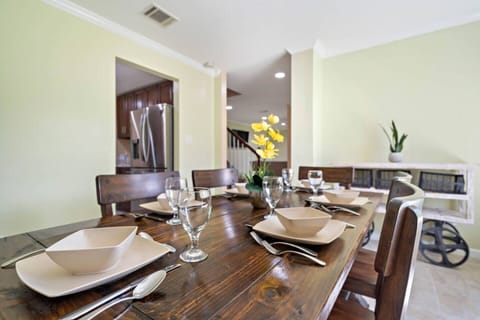 Spacious dining table that sits 6 with full tableware and silverware included.