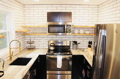 Beautiful stainless steel appliances in well appointed kitchen 