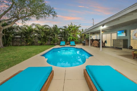 Lounge beside a heated pool and enjoy the outdoor living/dining/bar areas with smart TV