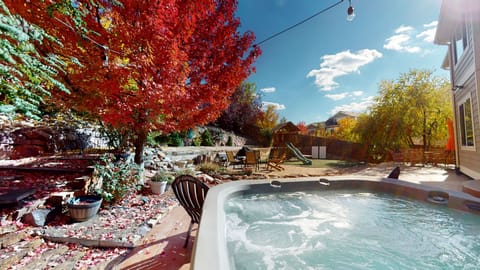 Relax, take in the views of the blue sky in this beautiful backyard