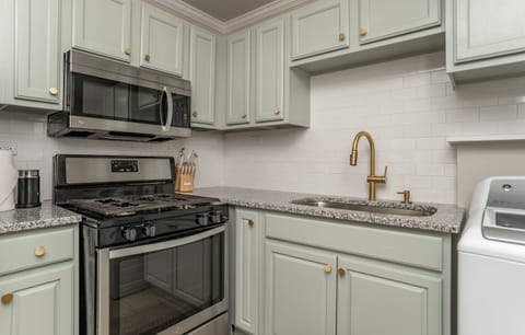 Gas range and stocked kitchen, washer and dryer as well 