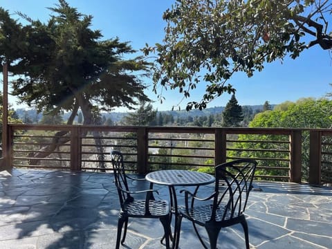 Enjoy coffee or cocktails on private patio with expansive view.