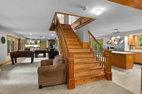 Spacious first floor with pool table, foosball, couches, wet bar, dining room and kitchen!