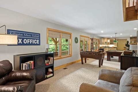 Spacious first floor with pool table, foosball, couches, wet bar, dining room and kitchen!