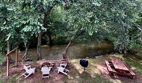 Enjoy the river sitting by the fire or using the charcoal BBQ.