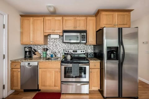 Granite countertops, dishwasher, microwave, coffee pot, toaster, pots and pans