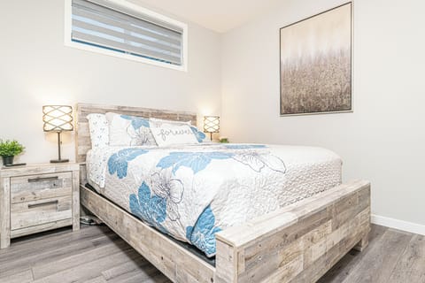 The main Bedroom is furnished with a queen bed and adjustable foundation.