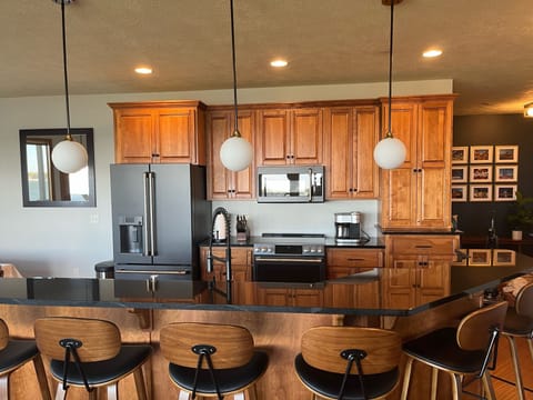 Six bar stools to facilitate friends and family time during meal prep