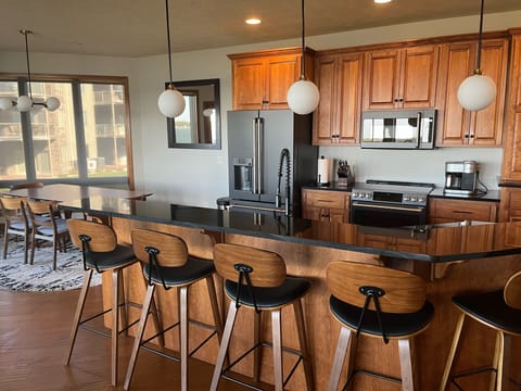 Six bar stools to facilitate friends and family time during meal prep