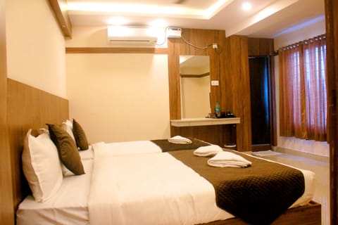 Premium bedding, desk, laptop workspace, blackout drapes
