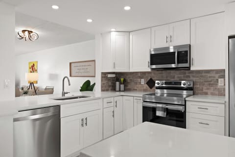 kitchen with solid surface counters and stainless steel appliances