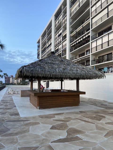 Tiki hut with sink, bar and grill