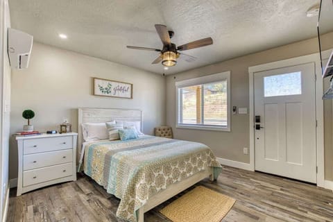 Comfortable, queen size bed with fresh farmhouse decor.