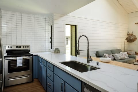 Whip up a meal in our bright, fully-stocked kitchen! Enjoy cooking and dining with ease in this open space.