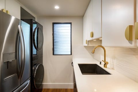 Stay fresh with in-unit laundry and a sleek utility space—because beach days are better when everything’s clean, dry, and easy.