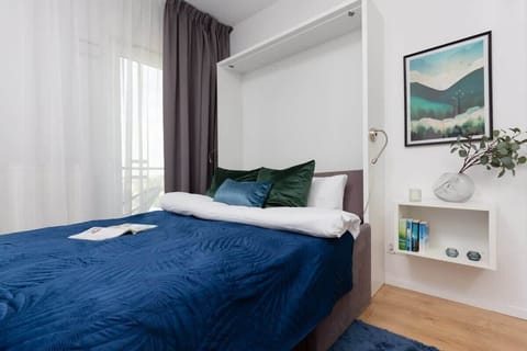 The elegant living room featuring a double bed.