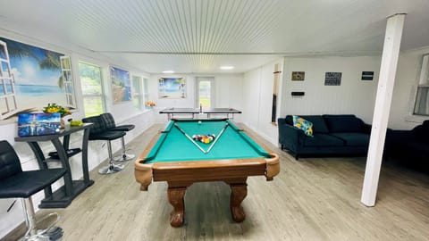 The ultimate fun GAME room!! Pool table, Ping Pong table, TV, cool AC, couches