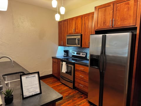 Full size refrigerator, microwave, stove and dishwasher. 