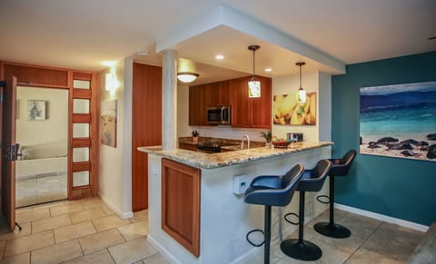 Gather together and mingle at the kitchen counter with bar seating for three.