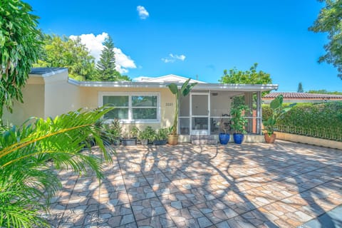 Lush entrance with space to accommodate 2 cars. First come, first serve parking.