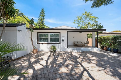 Lush entrance with space to accommodate 2 cars. First come, first serve parking.