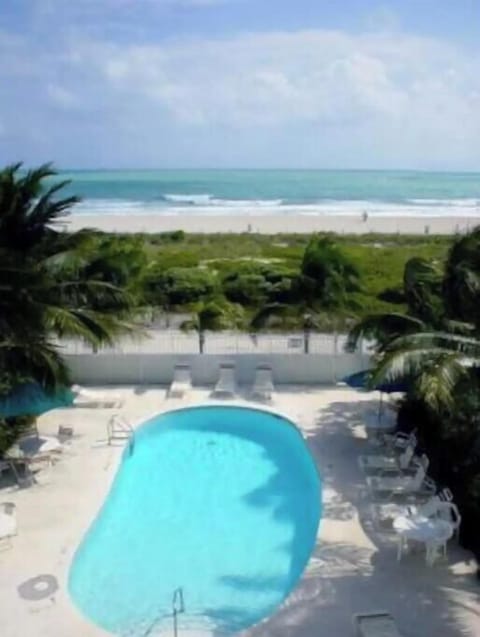 Pool and beach behind the building