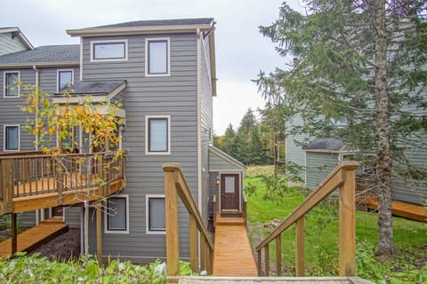 Stairs and walkway leading to the entrance of the condo