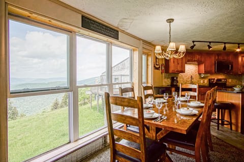 The dining room is located on the main level. Look at the beautiful view of Cupp Run & Shay's Revenge.