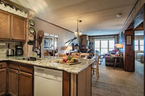 The kitchen features a newly installed (2024) granite countertops with bar seating.