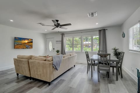 Looking Towards the Front Door and Sofa and Dining Set From the Kitchen