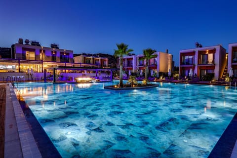 Seasonal outdoor pool, open 9:00 AM to 7:00 PM, pool umbrellas