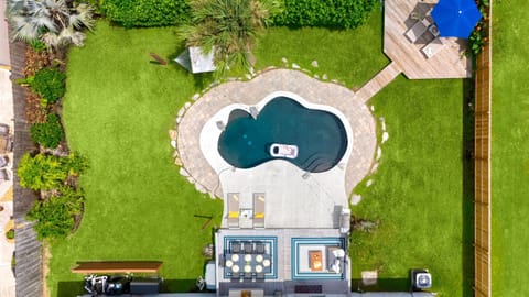 Bird's eye view of your sparkling pool and wide open play space
