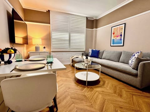Open plan living with large flatscreen wall mounted smart TV