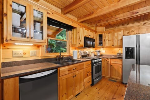 State of the Art Kitchen with all stainless steel appliances including an Oven, Microwave, Dishwasher, Duo Instapot with Airfryer, and tones of pots pans, cookware, bakeware and dinnerware.