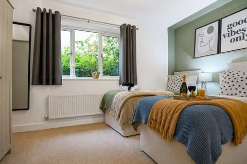 Bedroom 1 features a comfortable zip and link bed set up as twin beds by default or can be zipped as a king-size bed upon request.