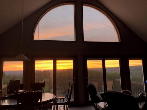 OVERALL:  The living room and deck with the sunset in the background