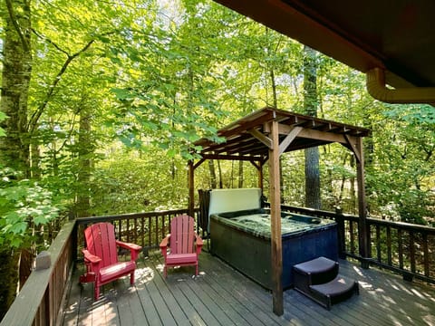 Covered hot tub on side deck