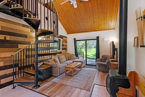 Living room with fireplace and custom wood backdrop