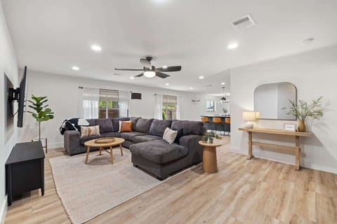 Living area with smart TV and plenty of seating.