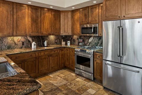 The kitchen is modern and fully-equipped