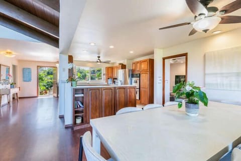 The open-concept kitchen connects seamlessly to the dining and living areas, making entertaining easy and inviting.