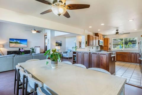 Create meals together in the spacious kitchen, featuring a large island with bar seating where guests can mingle while cooking.