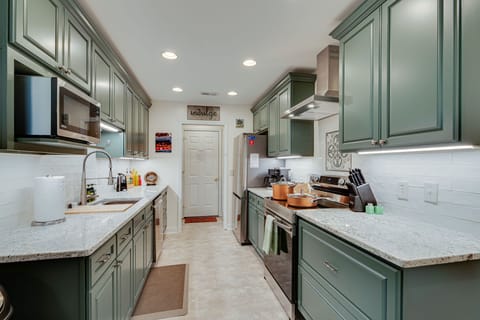 Shine like a chef in the bright gourmet kitchen of Sage Green cabinets