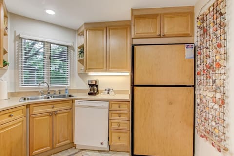 The full sized fridge has a built in icemaker.