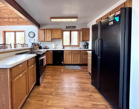 Our fully stocked kitchen has everything you need to enjoy a summer BBQ or warm up with soup at riding snowmobiles!