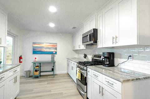 Kitchen with 2 sets of sliders out to pool 