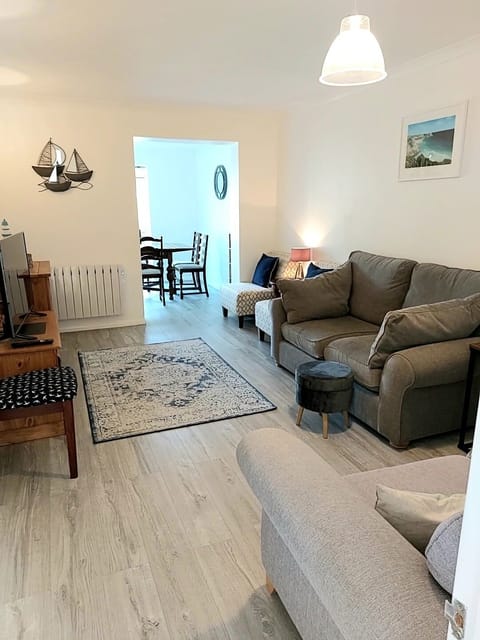 Living room leading to dining area and rear garden