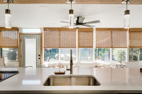 Kitchen is fully equipped with an electric stove with an oven, refrigerator, microwave, and a Keurig