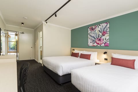 Desk, laptop workspace, iron/ironing board, free cribs/infant beds